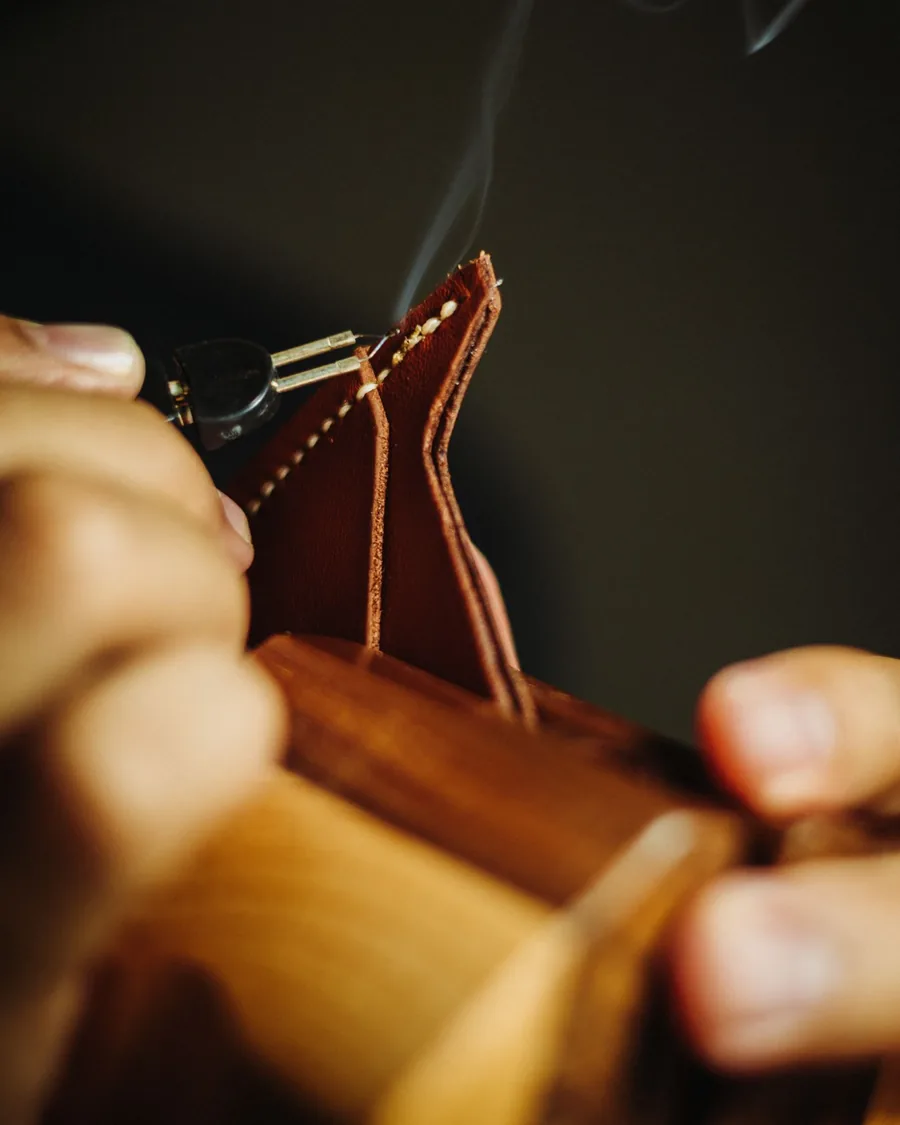 Hand-stitching a leather panel